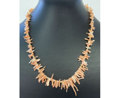 A vintage 18 inch branch coral necklace with spring style clasp.  