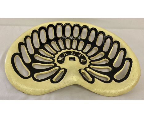 A cream and black painted cast metal 'Malta' tractor seat.  Approx. 45cm x 32cm.