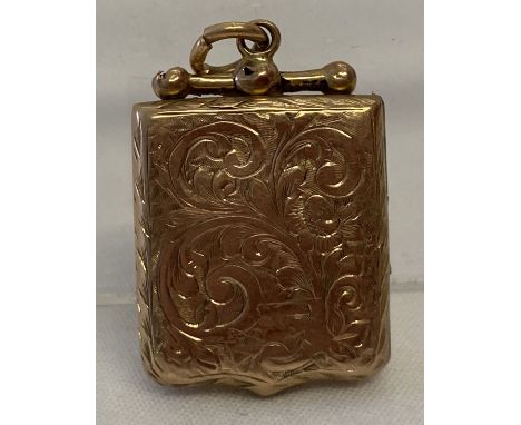 A vintage gold locket with floral decoration throughout and empty cartouche. Tests as 9ct gold. Some damage to top fixing. Ap