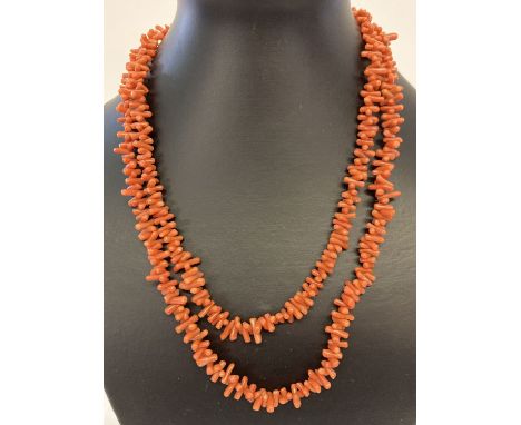A vintage 40 inch branch coral necklace with push barrel clasp.  