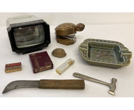 A collection of assorted misc. items to include smoking related items. Lot includes: boxed Ronson lighter, wooden handled cut