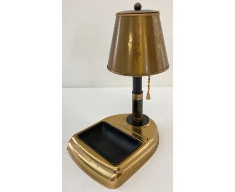 A vintage metal cigarette dispenser in the shape of a table lamp with ashtray. Star and floral decoration to lamp shade. Appr