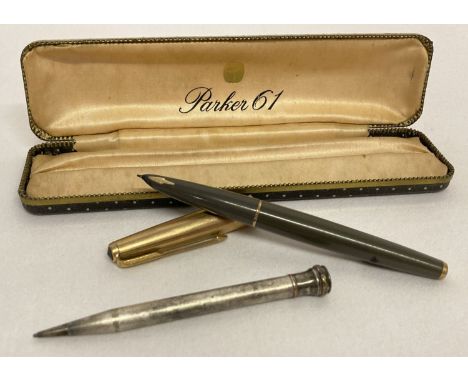 A vintage Parker 61 fountain pen in original box,  with 1/10 12ct Rolled gold lid and accents. Engine turned detail to lid wi