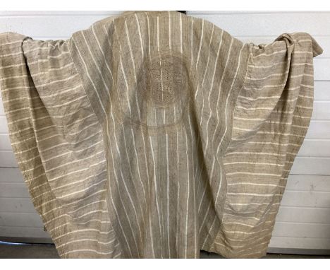 A large tribal style heavy linen robe with embroidery and panel detail in neutral tones.  