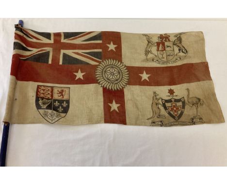 A vintage six nations flag issued as a souvenir at the 1924 British Empire Exhibition Flag attached to handmade flag pole pai