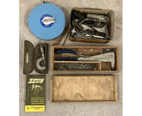 A vintage micrometer by Zuess Precision, complete with booklet. Together with Rabone Chesterman tape measure, a tin of mixed 