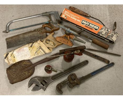 A collection of assorted vintage hand tools to include oil cans, wooden handled saws and files. Lot also includes a large Dia