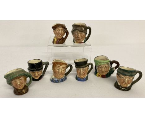 A collection of 8 miniature Royal Doulton ceramic toby jugs.  Tallest approx. 3.5cm tall.