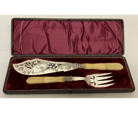Antique silver plated fish servers with carved bone handles. Decorative engraved blade and prongs with pierced work detail. K