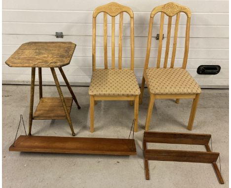 2 modern dinning chairs together with a vintage occasional table with 2 wall hanging shelves.  