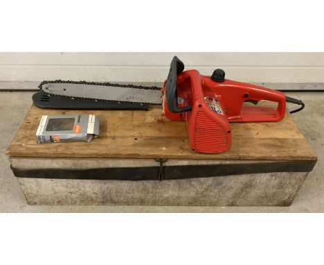 An electric chainsaw by Castell CS17E with 40cm blade. With plastic blade guard and handmade wooden carry box. Not tried or t