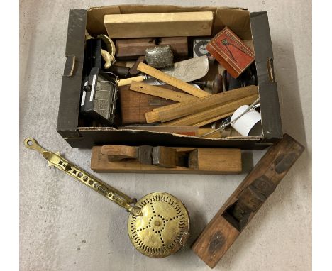 A box of assorted misc. vintage items to include box planes, wooden rules &amp; brass nut roaster.  
