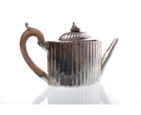 GEORGE III SILVER TEAPOT
maker William Plummer, London 1786, oval with concave fluted body, the partially gadrooned single do