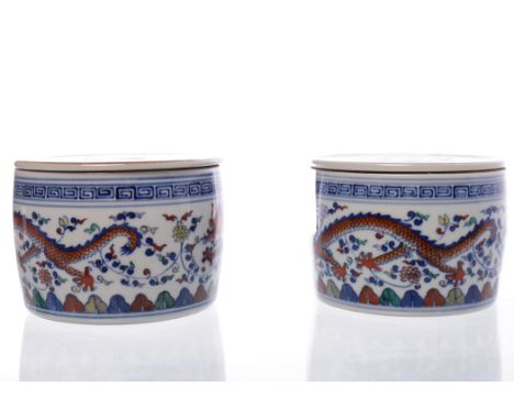 PAIR OF EARLY/MID 20TH CENTURY CHINESE CERAMIC CHESS SET CASKETS 
with dragon decoration, 12cm diameter 

