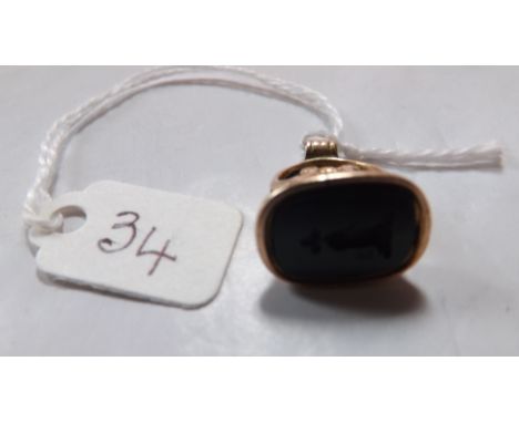 Antique 15ct gold & bloodstone fob seal set with carved   intaglio of a hand holding a flower.     