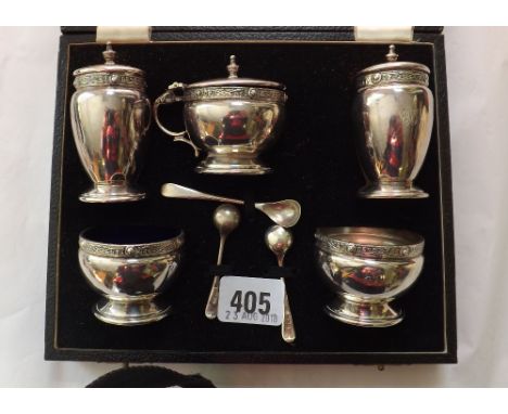 A boxed cruet set, five pieces plus three spoons with   Celtic edges Birm 1948 by GS & Co  230g approx   