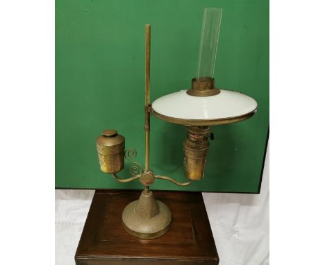 Indian brass table oil lamp with an opaline glass shade, 60cm high 