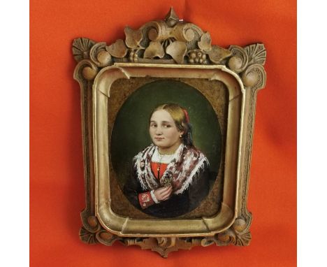 Miniature Oil on Paper, oval portrait of a possibly Bavarian girl in traditional costume holding a black flower, wearing a go