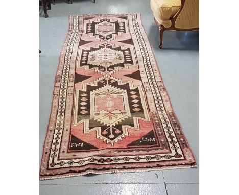 Long Persian Wool Floor Runner – brown and pink ground with central patterns, signed at the bottom, 2.75 m by 1.02m 