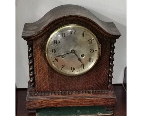 Mantel Clock in a rope edged oak case and with bevelled glass, 30cm x 29cm