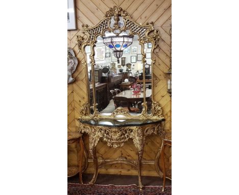 Good quality Reproduction French carved giltwood Console Table with shaped black marble top and a matching Console Mirror abo