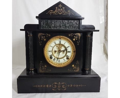 Ansonia black marble Mantel Clock with a visible escapement and a white dial, with raised gilt borders and a Roman design pan