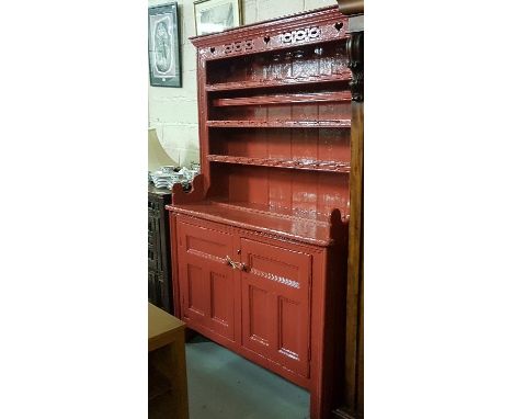 Irish Pine Kitchen Dresser, painted red, the open original top with “love heart” designs, over two presses below, enclosing a