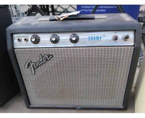 * A Fender Silver Face Champ Amplifier (Orange and Silver Grill Cloth; 1976-1980?) (speaker 3.2ohms, 6 watts Rms) (est £100-£