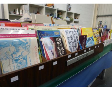Three boxes and ten divided shelves of music literature to include '' An Introductory Course to Playing the Flute'', ''The Ve