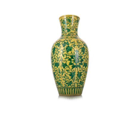 CHINESE FAMILLE JAUNE BALUSTER VASE, LATE 19TH/EARLY 20TH CENTURY decorated with green scrolling foliage, on a yellow ground,