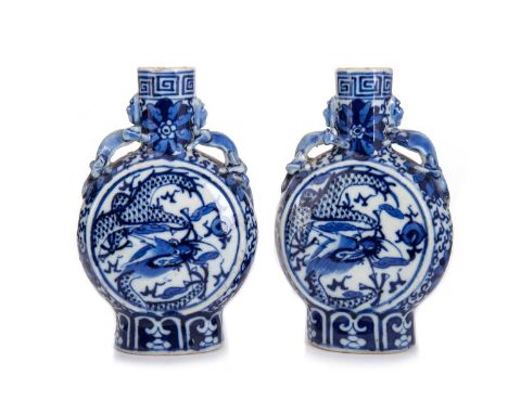 PAIR OF CHINESE BLUE AND WHITE MOONFLASKS, LATE 19TH/EARLY 20TH CENTURY  with twin lizard handles above each body decorated w