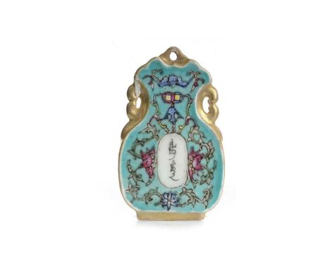 CHINESE FAMILLE ROSE PENDANT, LATE 19TH/EARLY 20TH CENTURY  bearing Chinese text, surrounded by flowers and scrolling foliage