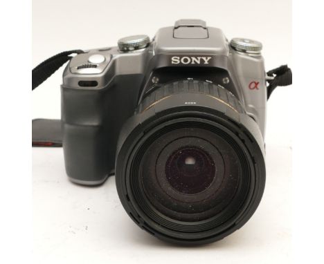A Sony a100 DSLR camera, with a Tamron AF 18-200mm lens.