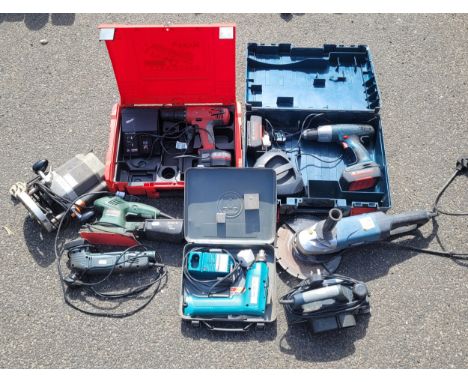 A collection of power tools to include, a boxed Makita 9,6v battery drill to include charger and battery, a boxed Milwaukee 1