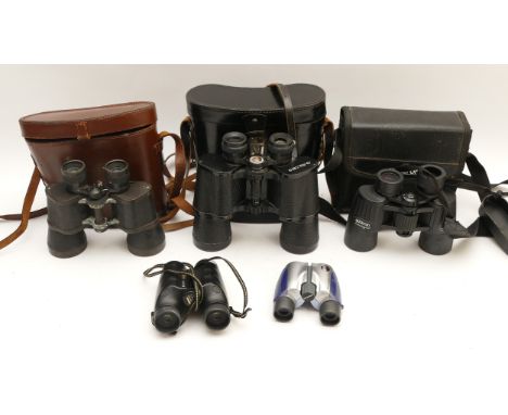 A collection of binoculars, to include, Opticron 8 x 42, Olympus 8 x 21, and a USSR 7 x 50.