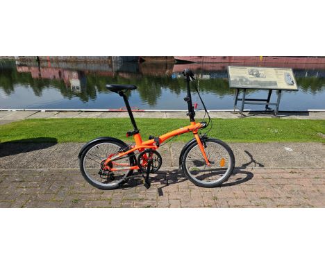 BTWIN, a Folding Bike Fold 500 , offered in orange with RevoShift 7 speed gears, unused. RRP £449