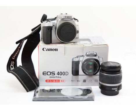 A Canon EOS 400D digital camera, with an EF-S f/3.5-5.6 18-55mm lens, in box.