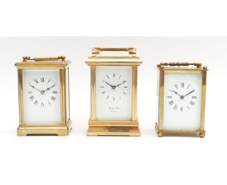 Three mid to late 20th century brass carriage clocks, housing eight day movements, to include, a Morrell &amp; Hilton example