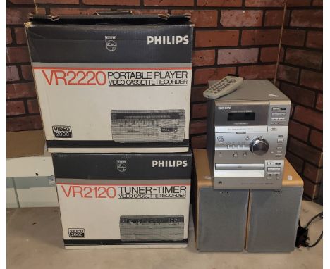 A 1980s Sony micro HI-Fi system, CMT-CP11, with speakers &amp; remote, together with two boxed Philips portable video cassett