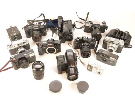 A collection of cameras and camera accessories, to include, a Praktica SuperTL, an Olympus OM101, and a Nikon Nikkor f/3.3-4.