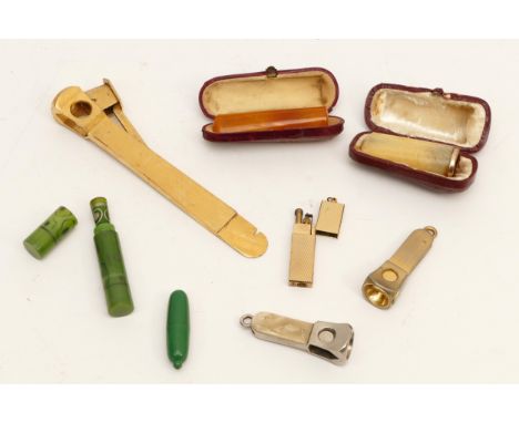 A collection of smokerama collectables, to include three cigar cutters, four cased cheroot holders and a cigarette lighter.