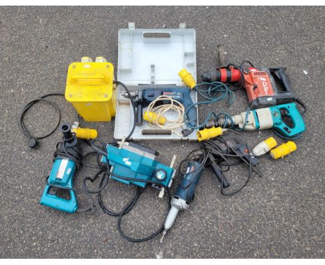A collection of power tools to include a 110v power tool transformer with 2 x 16a sockets, a 110 unbranded wood planer, a Wol