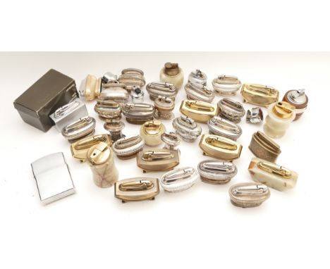 A collection of mid 20th century table cigarette lighters, petrol and gas operated, plated and onyx, primarily by Ronson, in 
