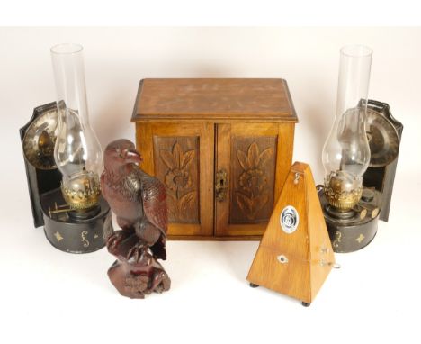 An oak two door smokers cabinet containing a five pipe rack lift out storage tray and two pull out drawers 30.5cm (h) x 18cm 