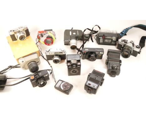 A collection of cameras and camera accessories, to include, a Panasonic C-2000ZM, a Praktica MTL5, and an AGFA Optima 335, a 