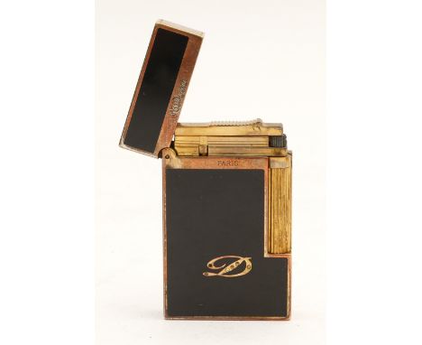 S.T.Dupont Paris; A Dupont pocket gas cigarette lighter, gents sized, gold plated with black enamel panels.