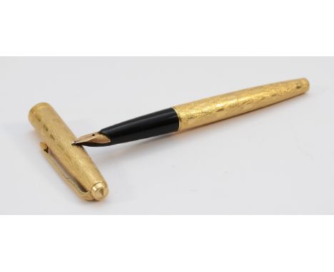 A Parker fountain pen, with a 14k gold nib, squeeze action filled.