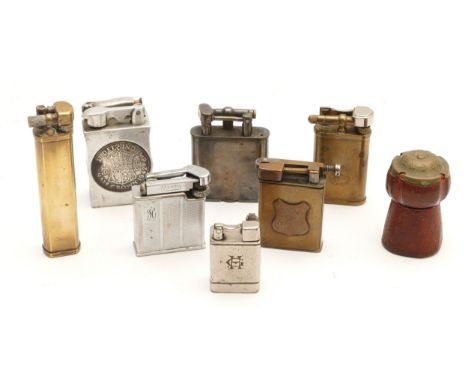 A collection of seven liftarm pocket cigarette lighters, petrol and gas operated, to include a 1920s Dunhill silver plated ex