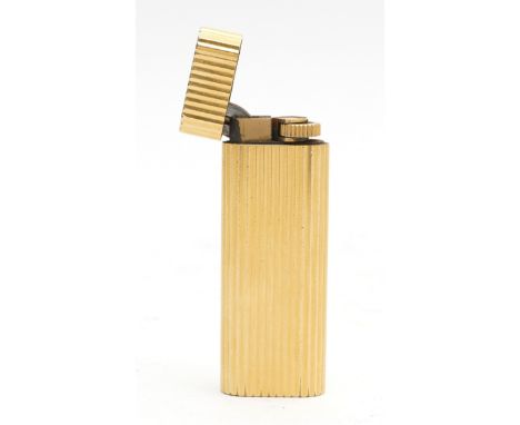 A Cartier gold plated pocket gas cigarette lighter, having slender ribbed body, stamped Cartier Paris and numbered 059701, le