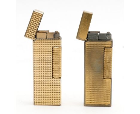 Alfred Dunhill Paris; A cased Dunhill rollagas pocket cigarette lighter, together with a loose example, having engine turned 